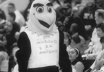 Old version of Eddie the Golden Eagle at an indoor athletic event.